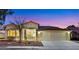 Charming single-story home with a three-car garage, desert landscaping, and a well-maintained front yard at 2725 Cool Lilac Ave, Henderson, NV 89052