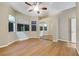 Bright main bedroom features wood floors, large closet with mirrored doors, and multiple windows at 2725 Cool Lilac Ave, Henderson, NV 89052