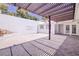 A tiled backyard covered by a wood pergola at 3511 Blackstone St, Las Vegas, NV 89121