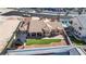 Expansive aerial view of the home showcasing lush landscaping, tile roof, and inviting outdoor spaces at 3665 S Pointe Cir, Laughlin, NV 89029
