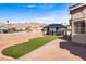 Expansive backyard with a gazebo, artificial grass, and desert landscaping, ideal for outdoor entertaining and relaxation at 3665 S Pointe Cir, Laughlin, NV 89029