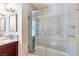 Elegant bathroom showcasing a glass shower with tiled walls, a built-in niche, and modern fixtures at 3665 S Pointe Cir, Laughlin, NV 89029