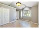 Spacious bedroom with vaulted ceiling, large window, and tile flooring provides a bright, airy feel at 3665 S Pointe Cir, Laughlin, NV 89029