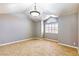 Vaulted ceiling bedroom with tile floors and an arched window for natural light at 3665 S Pointe Cir, Laughlin, NV 89029
