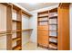 Walk-in closet with custom wood shelving and drawers for organization and storage at 3665 S Pointe Cir, Laughlin, NV 89029