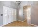 Grand entryway featuring high ceilings, decorative tile flooring, and a stylish front door with decorative glass inserts at 3665 S Pointe Cir, Laughlin, NV 89029