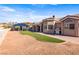 The backyard features a gazebo with a hot tub, artificial turf, and beautiful landscaping, enhancing outdoor living at 3665 S Pointe Cir, Laughlin, NV 89029
