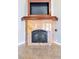 Beautiful marble fireplace with dark metal accents and a dark screen perfect to use during cold days and nights at 3665 S Pointe Cir, Laughlin, NV 89029