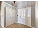 Well-lit foyer featuring neutral colored walls, tile flooring, and a closet for storage at 3665 S Pointe Cir, Laughlin, NV 89029