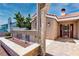 Charming single-story home showcasing a stucco exterior with a brick entryway and a red double door at 3665 S Pointe Cir, Laughlin, NV 89029