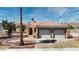 Inviting single-story home featuring a spacious two-car garage, tile roof, and charming desert landscaping at 3665 S Pointe Cir, Laughlin, NV 89029