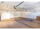Large, empty two-car garage with a utility sink and a door, offering potential for customization at 3665 S Pointe Cir, Laughlin, NV 89029