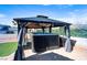 Relaxing backyard hot tub with gazebo and ambient lighting for perfect outdoor evenings at 3665 S Pointe Cir, Laughlin, NV 89029