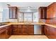 Custom kitchen featuring wood cabinets, granite countertops, and stainless steel appliances at 3665 S Pointe Cir, Laughlin, NV 89029