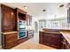 Open kitchen layout with double oven, granite countertops, and view of dining area at 3665 S Pointe Cir, Laughlin, NV 89029