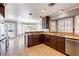 Open kitchen featuring granite countertops, custom wood cabinets, and stainless steel appliances at 3665 S Pointe Cir, Laughlin, NV 89029