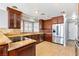 Well-equipped kitchen with custom wood cabinetry, stainless steel appliances, and granite countertops at 3665 S Pointe Cir, Laughlin, NV 89029
