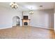 Spacious living room featuring a fireplace, tile floors, and arched doorway to the entry at 3665 S Pointe Cir, Laughlin, NV 89029