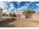 Low-maintenance backyard is defined by a brick planter along the perimeter of the yard at 3721 Brentcove Dr, North Las Vegas, NV 89032