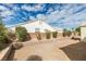 Backyard features desert landscaping and a low brick wall providing definition at 3721 Brentcove Dr, North Las Vegas, NV 89032