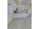 Open concept kitchen and living room featuring bright light, white countertops, and modern appliances at 3721 Brentcove Dr, North Las Vegas, NV 89032