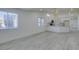 Open concept kitchen and living room area featuring light, wood-look floors and bright light at 3721 Brentcove Dr, North Las Vegas, NV 89032