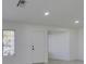 Bright living room with grey floors, all-white walls, and a large window at 3721 Brentcove Dr, North Las Vegas, NV 89032