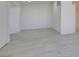 Bright living room with grey floors and all-white walls at 3721 Brentcove Dr, North Las Vegas, NV 89032