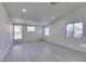Bright open-concept living room features light, modern floors, and large windows, creating a welcoming atmosphere at 3721 Brentcove Dr, North Las Vegas, NV 89032