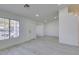 Bright living room with grey floors, all-white walls, and a large doorway at 3721 Brentcove Dr, North Las Vegas, NV 89032