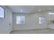 Bright living room features light, wood-look floors, white walls, and windows with natural light at 3721 Brentcove Dr, North Las Vegas, NV 89032
