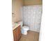 Bathroom with a tub shower combination, tile flooring, and single sink vanity at 4260 Vornsand Dr, Las Vegas, NV 89115