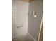 Bathroom with white shower tile and shelving at 4260 Vornsand Dr, Las Vegas, NV 89115