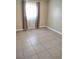 Bedroom featuring natural light, tile floors, and neutral paint at 4260 Vornsand Dr, Las Vegas, NV 89115