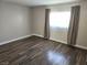 Bedroom featuring dark hardwood floors, natural light, and neutral colored walls at 4260 Vornsand Dr, Las Vegas, NV 89115