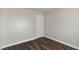 Clean bedroom featuring neutral paint, wood-look floors, and a standard closet door at 4260 Vornsand Dr, Las Vegas, NV 89115
