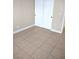 This bedroom features tile floors and bi-fold closet door at 4260 Vornsand Dr, Las Vegas, NV 89115