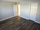 This bedroom features new wood floors, neutral walls, and a closet door at 4260 Vornsand Dr, Las Vegas, NV 89115