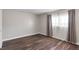 Bright bedroom featuring wood-look flooring, ample natural light, and neutral wall colors at 4260 Vornsand Dr, Las Vegas, NV 89115