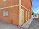 Exterior shot displaying secure entry gates, windows with bars, and low-maintenance gravel landscaping around the home at 4260 Vornsand Dr, Las Vegas, NV 89115