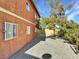 Side exterior view of the home features a stucco wall, desert landscaping and window coverings for added privacy at 4260 Vornsand Dr, Las Vegas, NV 89115
