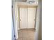 Hallway with sliding closet doors and tile flooring at 4260 Vornsand Dr, Las Vegas, NV 89115