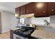 Cozy kitchen featuring modern appliances, granite countertops, and ample cabinet storage space at 4260 Vornsand Dr, Las Vegas, NV 89115