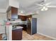 Updated kitchen features granite counters, ample cabinetry, and modern stainless steel appliances at 4260 Vornsand Dr, Las Vegas, NV 89115