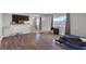 Inviting open-concept living space with updated floors, great light, and kitchen bar at 4260 Vornsand Dr, Las Vegas, NV 89115