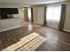 Open living room with natural light from large windows and view into kitchen at 4260 Vornsand Dr, Las Vegas, NV 89115