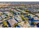 An aerial view of a vibrant residential community with modern homes and well-maintained streets, with the subject home outlined at 43 Grey Feather Dr, Las Vegas, NV 89135