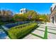 A backyard features lush greenery and a beautiful pool, perfect for relaxation at 43 Grey Feather Dr, Las Vegas, NV 89135