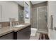 Bathroom featuring a glass-enclosed shower, modern vanity, and neutral color palette at 43 Grey Feather Dr, Las Vegas, NV 89135