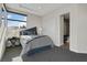 Comfortable bedroom featuring neutral tones and a large window for natural light at 43 Grey Feather Dr, Las Vegas, NV 89135